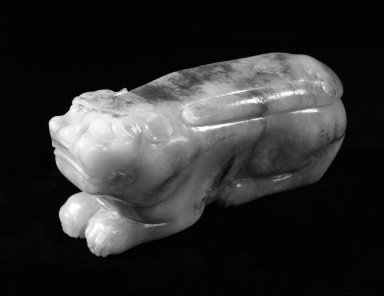  <em>Carving of a Recumbent Tiger</em>, 17th century. Nephrite, 1 7/8 x 3 3/4 in. (4.8 x 9.5 cm). Brooklyn Museum, Gift of Stanley Herzman, 78.85.6. Creative Commons-BY (Photo: Brooklyn Museum, 78.85.6_bw.jpg)