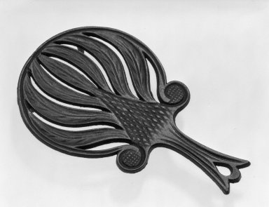 American. <em>Trivet</em>, ca. 1850. Cast iron, black., 5 1/2 x 9 in. (14 x 22.9 cm). Brooklyn Museum, Gift of Mrs. James Cole, 79.10.6. Creative Commons-BY (Photo: Brooklyn Museum, 79.10.6_bw.jpg)