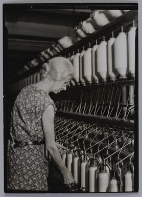 Lewis Wickes Hine (American, 1874-1940). <em>[Untitled] (Elderly Woman at Bank of Thread Cylinders)</em>, 1936-1937. Gelatin silver print, 7 1/4 x 4 3/4 in. (18.4 x 12.1 cm). Brooklyn Museum, Gift of the National Archives, 79.143.130 (Photo: Brooklyn Museum, 79.143.130_PS20.jpg)