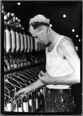 Lewis Wickes Hine (American, 1874-1940). <em>[Untitled] (Man in Cap Holding Thread)</em>, 1936-1937. Gelatin silver photograph, 7 1/4 x 4 3/4 in. (18.4 x 12.1 cm). Brooklyn Museum, Gift of the National Archives, 79.143.61 (Photo: Brooklyn Museum, 79.143.61_bw.jpg)