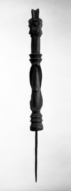 Wurkun. <em>Figure with Spike (Wundul)</em>, early 20th century. Wood, iron, 21 3/4 x 1 3/4 x 2 in. (55.2 x 4.5 x 5.2 cm). Brooklyn Museum, Gift of Dr. and Mrs. Abbott A. Lippman, 79.161.2. Creative Commons-BY (Photo: Brooklyn Museum, 79.161.2_bw.jpg)