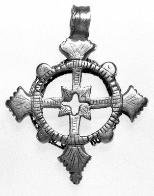 Amhara. <em>Pendant Cross</em>, 19th or 20th century. Silver, 2 x 1 5/8 in. (5.0 x 4.2 cm). Brooklyn Museum, Gift of George V. Corinaldi Jr., 79.72.11. Creative Commons-BY (Photo: Brooklyn Museum, 79.72.11_bw.jpg)