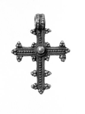 Amhara. <em>Pendant Cross</em>, 19th or 20th century. Silver, 1 7/8 x 1 3/8 in. (4.8 x 3.5 cm). Brooklyn Museum, Gift of George V. Corinaldi Jr., 79.72.28. Creative Commons-BY (Photo: Brooklyn Museum, 79.72.28_view1_bw.jpg)