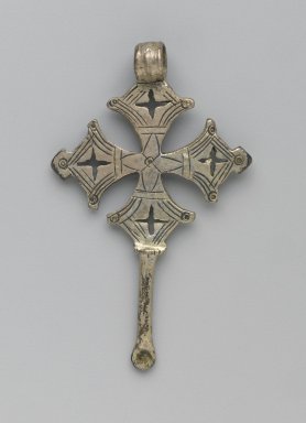 Amhara. <em>Pendant Cross with Ear Cleaner Extension</em>, 19th or 20th century. Silver, 2 1/2 x 1 1/2 in. (6.3 x 3.8 cm). Brooklyn Museum, Gift of George V. Corinaldi Jr., 79.72.3. Creative Commons-BY (Photo: Brooklyn Museum, 79.72.3_front_PS6.jpg)