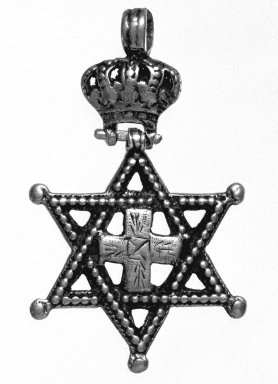 Amhara. <em>Pendant Cross with Crown and Star of David</em>, 19th or 20th century. Silver, 2 3/8 x 1 3/8 in. (6.0 x 3.5 cm). Brooklyn Museum, Gift of George V. Corinaldi Jr., 79.72.6. Creative Commons-BY (Photo: Brooklyn Museum, 79.72.6_bw.jpg)