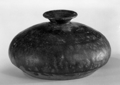  <em>Oil Bottle</em>, 12th-13th century. Glazed stoneware, 2 5/8 x 4 3/4 in. (6.7 x 12.1 cm). Brooklyn Museum, Gift of Dr. Andrew Dahl, 80.115.5. Creative Commons-BY (Photo: Brooklyn Museum, 80.115.5_bw.jpg)