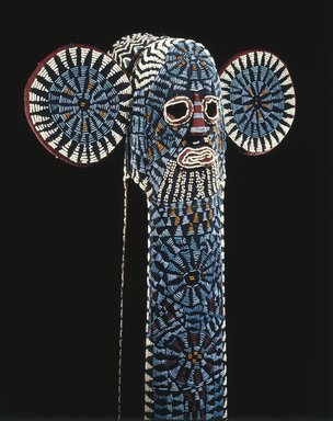 Bamileke. <em>Kuosi Society Elephant Mask</em>, 20th century. Cloth, beads, raffia, fiber, 57 3/4 x 20 1/2 x 11 1/2 in. (146.7 x 52.1 x 29.2 cm). Brooklyn Museum, Purchased with funds given by Mr. and Mrs. Milton F. Rosenthal, 81.170. Creative Commons-BY (Photo: Brooklyn Museum, 81.170_detail_SL1.jpg)