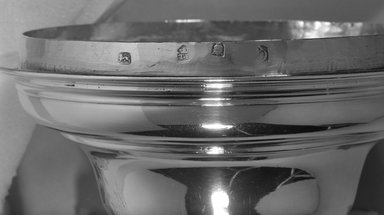 David Willaume Sr.. <em>Two-Handled Cup with Cover</em>, ca. 1702-1703. Silver, 12 1/4 in.  (31.1 cm) ; cup height: 7 3/8 in. (31.1cm) diameter top: 6 1/2 in. (16.5 cm) diameter at base: 4 5/8 in.  (11.7 cm) ; top height 4 7/8 in. (12.4 cm) diameter 7 1/4 in. (18.4 cm). Brooklyn Museum, Gift of Wunsch Americana Foundation, Inc., 81.177.3. Creative Commons-BY (Photo: Brooklyn Museum, 81.177.3_cover_mark_bw.jpg)