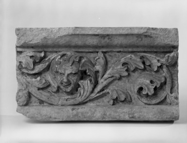 Unknown (American). <em>Foliate Border with Head, from Turner Towers, 135 Eastern Parkway, Brooklyn</em>, 1928. Cast Stone: cement composition and vitreous enamel, Other: 9 x 8 x 9 in. (22.9 x 20.3 x 22.9 cm). Brooklyn Museum, Gift of Charles Free, 81.209.10. Creative Commons-BY (Photo: Brooklyn Museum, 81.209.10_bw.jpg)