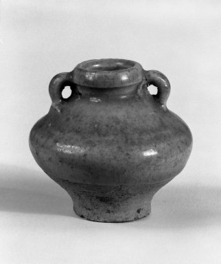  <em>Eared Jarlet</em>, 14th-15th century. Stoneware with olive-green glaze, 2 1/2 x 2 1/2 in. (6.4 x 6.4 cm). Brooklyn Museum, Gift of Dr. Jerome Krieger, 81.289.7. Creative Commons-BY (Photo: Brooklyn Museum, 81.289.7_cropped_bw.jpg)