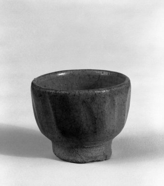  <em>Small Cup</em>, 14th-15th century. Stoneware with blue-green glaze, 1 3/4 x 2 1/4 in. (4.4 x 5.7 cm). Brooklyn Museum, Gift of Dr. Jerome Krieger, 81.289.8. Creative Commons-BY (Photo: Brooklyn Museum, 81.289.8_cropped_bw.jpg)