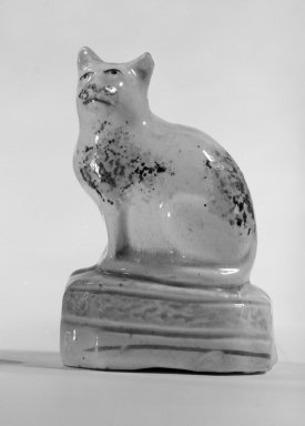  <em>Figure of a Cat</em>, ca. 1820. Lead-glazed earthenware, 3 x 2 1/8 x 1 1/2 in. (7.6 x 5.4 x 3.8 cm). Brooklyn Museum, Bequest of Dr. Grace McLean Abbate, 81.53.11. Creative Commons-BY (Photo: Brooklyn Museum, 81.53.11_cropped_bw.jpg)