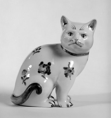  <em>Figure of a Cat</em>, possibly 19th century (body); 20th century (decoration). Hard-paste porcelain, 5 1/4 x 5 x 3 1/2 in. (13.3 x 12.7 x 8.9 cm). Brooklyn Museum, Bequest of Dr. Grace McLean Abbate, 81.53.17. Creative Commons-BY (Photo: Brooklyn Museum, 81.53.17_bw.jpg)