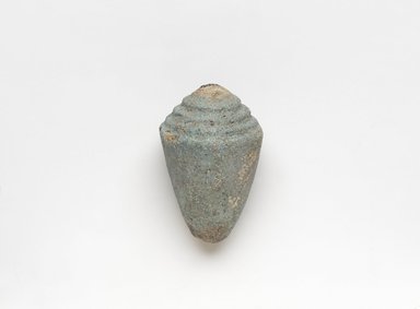  <em>Model Shell</em>, ca. 1836–1700 B.C.E. Faience, 1 3/16 x 1 7/8 in. (3 x 4.7 cm). Brooklyn Museum, Gift of Peter Sharrer, 82.170.2. Creative Commons-BY (Photo: , 82.170.2_PS9.jpg)