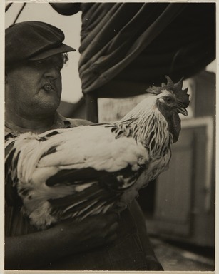 Consuelo Kanaga (American, 1894-1978). <em>Man with Rooster</em>, ca. 1936. Gelatin silver print, frame: 20 5/16 × 15 5/16 × 1 1/2 in. (51.6 × 38.9 × 3.8 cm). Brooklyn Museum, Gift of Wallace B. Putnam from the Estate of Consuelo Kanaga, 82.65.395 (Photo: Brooklyn Museum, 82.65.395_PS20.jpg)