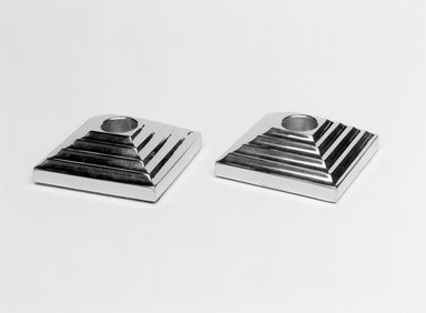 Norman Bel Geddes (American, 1893–1958). <em>"Manhattan" Candlestick, One of a Pair</em>, 1937. Chromed metal, 1 1/16 x 3/1/8 x 3 1/8 in. (2/7 x 8.0 x 8.0 cm). Brooklyn Museum, Gift of Paul F. Walter, 83.108.15. Creative Commons-BY (Photo: , 83.108.15_83.108.16_bw.jpg)