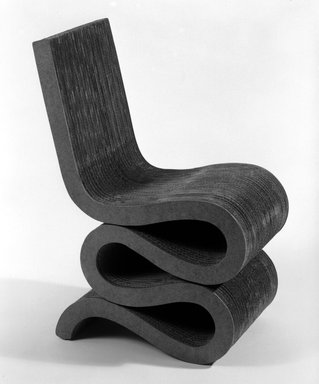 Frank Gehry (American, born 1929). <em>Side Chair, "Easy Edges,"</em> designed 1971; manufactured ca. 1982. Corrugated cardboard, pressed board, wood, 33 3/8 x 14 x 23 1/4 in. (84.8 x 35.6 x 59.1 cm). Brooklyn Museum, Gift of Paul F. Walter, 83.108.1. Creative Commons-BY (Photo: Brooklyn Museum, 83.108.1_view1_bw.jpg)
