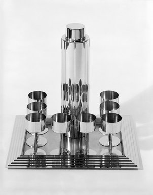 Norman Bel Geddes (American, 1893-1958). <em>Cocktail Glass, One of Eight</em>, 1937. Chrome-plated metal, 4 5/16 x 2 1/2 x 2 1/2 in. (11 x 6.4 x 6.4 cm). Brooklyn Museum, Gift of Paul F. Walter, 83.108.9. Creative Commons-BY (Photo: , 83.108.5-.14_view3_bw_SL3.jpg)