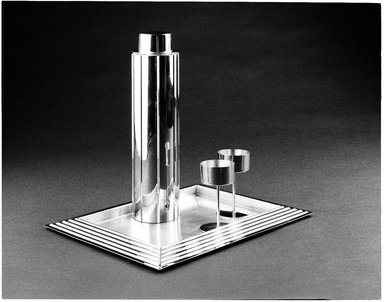 Norman Bel Geddes (American, 1893–1958). <em>"Skyscraper" Cocktail Shaker with Strainer and Lid</em>, Designed 1934. Manufactured 1935. Chrome-plated metal, 13 1/8 x 3 5/16 x 3 5/16 in. (33.02 x 8.4 x 8.4 cm). Brooklyn Museum, Gift of Paul F. Walter, 83.108.5a-c. Creative Commons-BY (Photo: Brooklyn Museum, 83.108.5a-c_SL3.jpg)