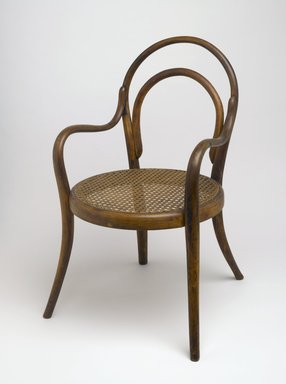 Gebrüder Thonet (Austrian, founded Vienna, 1842). <em>Child's Armchair</em>, ca. 1875. Copper beech, modern caning, metal screws, 24 3/4 x 14 x 17 1/4 in. (62.9 x 35.6 x 43.8 cm). Brooklyn Museum, Gift of Dr. Barry R. Harwood, 83.155. Creative Commons-BY (Photo: Brooklyn Museum, 83.155_PS6.jpg)