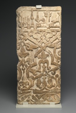  <em>Dado Panel from the Courtyard of the Royal Palace of Mas`ud III of Ghazni (reigned A.H. 493-509/1099-1115 C.E.</em>, 1 Ramadan 505 AH / 22 March 1112. Carved marble, 2009 dimensions: 28 1/8 x 12 13/16 x 3 1/2 in. (71.4 x 32.5 x 8.9 cm). Brooklyn Museum, Gift of Mr. and Mrs. Hans G. Clapper, 83.163. Creative Commons-BY (Photo: Brooklyn Museum, 83.163_PS2.jpg)