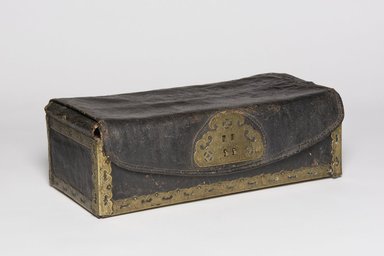  <em>Sutra Case</em>, late 19th-early 20th century. Wood covered with black leather bound with engraved brass, 6 x 17 3/4 x 9 1/4 in.  (15.2 x 45.1 x 23.5 cm). Brooklyn Museum, Gift of Dr. and Mrs. John P. Lyden, 83.168.12. Creative Commons-BY (Photo: , 83.168.12_threequarter_PS11.jpg)