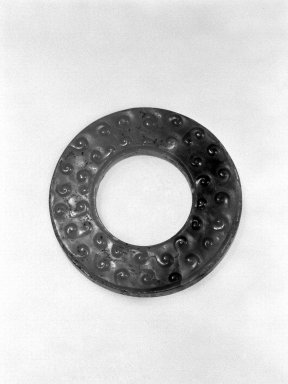  <em>Jade Pi (Disc Symbolic of Heaven)</em>, 20th century. Jade (nephrite), Diam.: 1 3/4 in. (4.4 cm). Brooklyn Museum, Gift of Dr. and Mrs. John P. Lyden, 83.168.2. Creative Commons-BY (Photo: Brooklyn Museum, 83.168.2_cropped_bw.jpg)