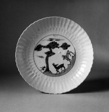  <em>Plate</em>, 1621–1627. Porcelain with underglaze, 1 3/8 x 7 15/16 in. (3.5 x 20.1 cm). Brooklyn Museum, Gift of Dr. Ralph C. Marcove, 83.243.2. Creative Commons-BY (Photo: Brooklyn Museum, 83.243.2_bw.jpg)