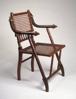 George Jacob Hunzinger (American, born Germany, 1835–1898). <em>Armchair</em>, ca. 1876. Walnut, steel mesh, fabric, 33 3/8 x 21 x 18 1/2 in. (84.8 x 53.3 x 47 cm). Brooklyn Museum, H. Randolph Lever Fund, 83.27. Creative Commons-BY (Photo: Brooklyn Museum, 83.27_IMLS_SL2.jpg)