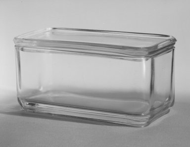 Wilhelm Wagenfeld (1900-1990). <em>Rectangular Container with Lid, from 10-Piece Set of Kitchen Storage Glassware, Kubus</em>, ca. 1938. Clear glass, width: 3 5/8 in. (9.1 cm). Brooklyn Museum, Gift of Barry Friedman, 84.121.6a-b. Creative Commons-BY (Photo: Brooklyn Museum, 84.121.6a-b_bw.jpg)