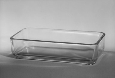 Wilhelm Wagenfeld (1900-1990). <em>Rectangular Container, from 10-Piece Set of Kitchen Storage Glassware, Kubus</em>, 1938. Clear glass, 1 3/4 x 3 5/8 x 7 1/8 in. (4.3 x 9.2 x 18.0 cm). Brooklyn Museum, Gift of Barry Friedman, 84.121.8. Creative Commons-BY (Photo: Brooklyn Museum, 84.121.8_bw.jpg)