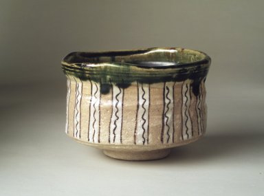 Sasaki Tatsuji (Japanese). <em>Oribe Ware Tea Bowl</em>, ca. 1980. Buff stoneware, 8 x 4 1/4 in. (20.3 x 10.8 cm). Brooklyn Museum, Gift of Dr. Kenneth Rosenbaum, 84.203.19. Creative Commons-BY (Photo: Brooklyn Museum, 84.203.19.jpg)