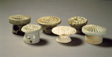  <em>Rice-Cake Mold</em>, 19th century. Porcelain with glaze, 1 5/8 x 3 in.  (4.1 x 7.6 cm). Brooklyn Museum, Gift of Dr. and Mrs. John P. Lyden, 84.261.14. Creative Commons-BY (Photo: , 84.261.10-.15.jpg)