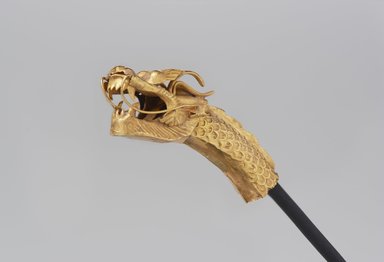  <em>Finial in the Shape of a Dragon Head</em>, 14th century. Gold, overall: 1 5/8 x 1/2 x 5/16 in. (4.2 x 1.2 x 0.8 cm). Brooklyn Museum, Purchase gift of Mr. and Mrs. A. B. Martin, 84.36. Creative Commons-BY (Photo: Brooklyn Museum, 84.36_threequarter_left_PS11.jpg)