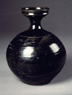  <em>Bottle</em>, 19th century. Stoneware with glaze, Height: 7 1/4 in. (18.4 cm). Brooklyn Museum, Gift of Mr. and Mrs. Roger Elliot and Mr. and Mrs. Jack Ford in memory of Jean Alexander, 85.114.5. Creative Commons-BY (Photo: Brooklyn Museum, 85.114.5.jpg)
