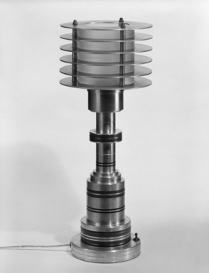 Possibly Walter von Nessen (American, born Germany, 1889-1943). <em>Lamp</em>, ca. 1930. Aluminum, plastic resin (probably Bakelite), brass, glass, 20 x 8 x 8 in. (50.8 x 20.3 x 20.3 cm). Brooklyn Museum, H. Randolph Lever Fund, 85.78.2. Creative Commons-BY (Photo: Brooklyn Museum, 85.78.2_view2_bw.jpg)
