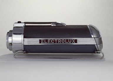 Lurelle Guild (American, 1898–1985). <em>Vacuum Cleaner</em>, ca. 1937. Chromed, polished and enameled steel; cast aluminum; vinyl; rubber, 8 1/2 x 23 x 7 3/4 in.  (21.6 x 58.4 x 19.7 cm). Brooklyn Museum, Gift of Fifty/50, 86.15a-f. Creative Commons-BY (Photo: Brooklyn Museum, 86.15a-f_SL3.jpg)