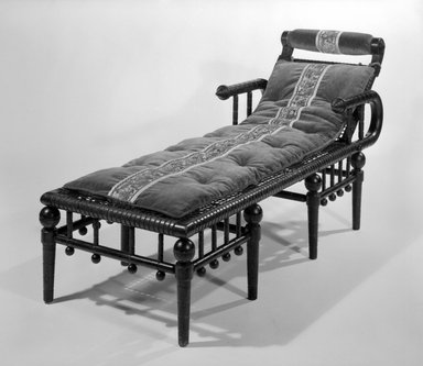 George Jacob Hunzinger (American, born Germany, 1835-1898). <em>Daybed</em>, Patented April 28, 1876. Maple and cloth-covered metal strips, late 19th century English textile applied to head rest and used to make cushion on bed., 31 x 25 x 66 in. (78.7 x 63.5 x 167.6 cm). Brooklyn Museum, Gift of Bruce Newman, 86.177. Creative Commons-BY (Photo: Brooklyn Museum, 86.177_view1_bw.jpg)