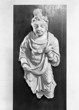  <em>Buddhist Figure</em>, 4th-6th century. Stucco sculpture, 17 5/8 x 8 1/8 x 4 1/8 in. (44.8 x 20.6 x 10.5 cm). Brooklyn Museum, Gift of Georgia and Michael de Havenon, 86.183.7. Creative Commons-BY (Photo: Brooklyn Museum, 86.183.7_bw.jpg)