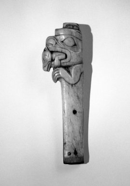 Possibly Tlingit. <em>Dagger Handle in Form of a Bear with a Creature in its Mouth</em>, 19th century. Iron, ivory, 16.5 x 5.1 x 2.2 cm / 6 1/2 x 7/8 in. Brooklyn Museum, Gift of the Ernest Erickson Foundation, Inc., 86.224.174. Creative Commons-BY (Photo: Brooklyn Museum, 86.224.174_bw.jpg)