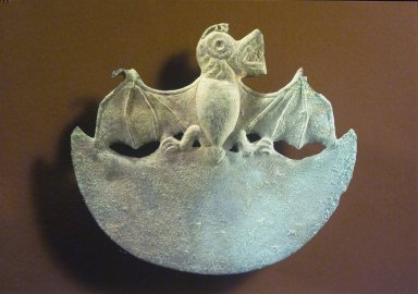 Moche. <em>Crescent-Shaped Ornament with Bat</em>, 1-300 C.E. Hammered copper, 4 1/8 x 4 5/8 in.  (10.5 x 11.7 cm). Brooklyn Museum, Gift of the Ernest Erickson Foundation, Inc., 86.224.202. Creative Commons-BY (Photo: Brooklyn Museum, 86.224.202.jpg)