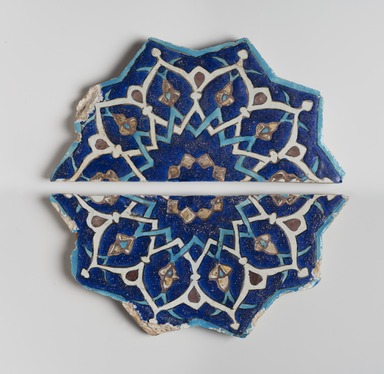  <em>Ten-Pointed Star Tile</em>, mid-15th century. Ceramic; fritware, painted in cobalt blue, turquoise, and opaque white glazes with manganese purple in the cuerda seca (dry-cord) technique, with leaf gilding, 14 1/2 x 1 1/4 x 15 in. (36.8 x 3.2 x 38.1 cm). Brooklyn Museum, Gift of the Ernest Erickson Foundation, Inc., 86.227.196a-b. Creative Commons-BY (Photo: Brooklyn Museum, 86.227.196a-b_PS11.jpg)