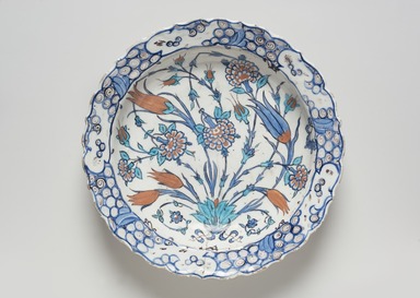  <em>Plate</em>, ca. 1560. Ceramic, cobalt-blue, turquoise, red and white glazes, 2 13/16 x 12 3/16 in. (7.1 x 31 cm). Brooklyn Museum, Gift of the Ernest Erickson Foundation, Inc., 86.227.201. Creative Commons-BY (Photo: Brooklyn Museum, 86.227.201_PS11.jpg)
