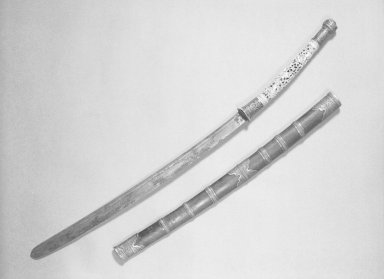  <em>Sword and Silver-Mounted Wood Sheath</em>, 17th century. Bronze with pierce-work ivory handle, 29 x 1 3/16 in. (73.7 x 3 cm). Brooklyn Museum, Gift of the Ernest Erickson Foundation, Inc., 86.227.35a-b. Creative Commons-BY (Photo: Brooklyn Museum, 86.227.35a-b_acetate_bw.jpg)