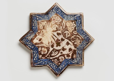  <em>Eight-pointed Star Tile</em>, ca. 1290–91. Ceramic; fritware, painted in cobalt blue and luster on an opaque white glaze, 8 7/16 x 1/2 in. (21.4 x 1.2 cm). Brooklyn Museum, Gift of the Ernest Erickson Foundation, Inc., 86.227.70. Creative Commons-BY (Photo: Brooklyn Museum, 86.227.70_PS11.jpg)