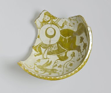  <em>Fragment of a Bowl Depicting a Mounted Warrior</em>, 11th century. Ceramic; earthenware, painted in luster on an opaque white glaze, 15 1/2 x 15 1/2in. (39.4 x 39.4cm). Brooklyn Museum, Gift of the Ernest Erickson Foundation, Inc., 86.227.83. Creative Commons-BY (Photo: Brooklyn Museum, 86.227.83_top_PS1.jpg)