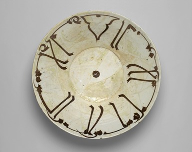  <em>Bowl with Kufic Calligraphy</em>, 10th century. Ceramic; earthenware, painted in brown slip on a white slip ground under a transparent glaze, 5 1/16 in. (12.9 cm). Brooklyn Museum, Gift of the Ernest Erickson Foundation, Inc., 86.227.8. Creative Commons-BY (Photo: Brooklyn Museum, 86.227.8_PS2.jpg)