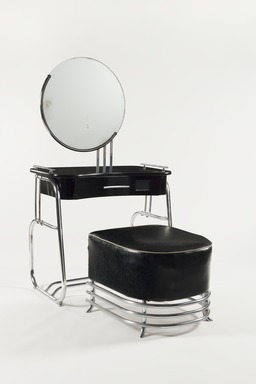 Kem Weber (American, born Germany, 1889–1963). <em>Vanity with Mirror</em>, 1934. Chrome-plated tubular steel, wood, glass, 55 x 33 x 19 1/2 in. (139.7 x 83.8 x 49.5 cm). Brooklyn Museum, Modernism Benefit Fund, 87.123.1a-b. Creative Commons-BY (Photo: Brooklyn Museum, 87.123.1a-b_overall_PS22.jpg)