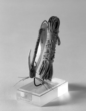  <em>Trolling Hook</em>. Shell, bone, fiber, feathers, 3 1/2 x 5/8 x 1 1/8 in. (8.9 x 1.6 x 2.9 cm). Brooklyn Museum, Gift of Marcia and John Friede and Mrs. Melville W. Hall, 87.218.106. Creative Commons-BY (Photo: Brooklyn Museum, 87.218.106_bw.jpg)