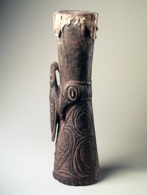 Iatmul. <em>Drum</em>, early 20th century. Wood, snake skin, coir, pigment, 24 1/2 x 6 x 7 in. (62.2 x 15.2 x 17.8 cm). Brooklyn Museum, Gift of Marcia and John Friede and Mrs. Melville W. Hall, 87.218.12. Creative Commons-BY (Photo: Brooklyn Museum, 87.218.12.jpg)